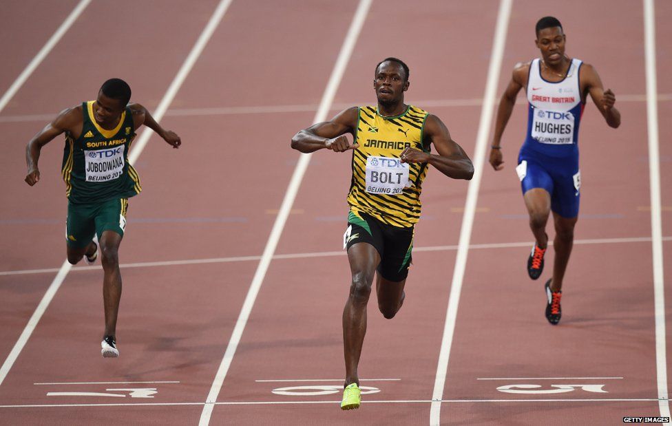 Usain Bolt (C) winning Gold at the World Athletics Championships Beijing 2015