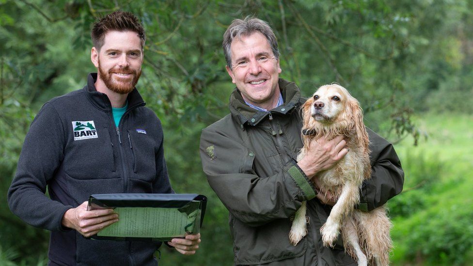 Image of Dan Norris and his dog with the CEO of Bristol Avon Rivers Trust, Simon Hunter