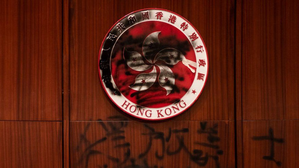 Hong Kong emblem defaced by a graffiti during the demonstration.