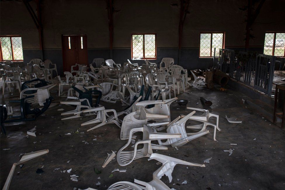 Broken chairs litter the floor of the Catholic church in the village is seen on June 27, 2018, after Fulani herdsman attacked the village.