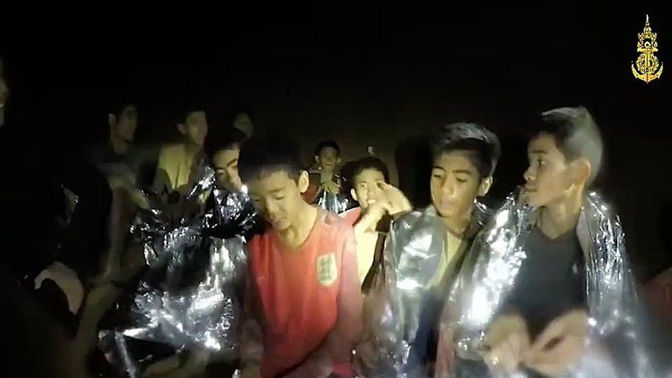 A video grab handout made available by the Thai Navy SEALs shows some members of the trapped football team, 4 July 2018