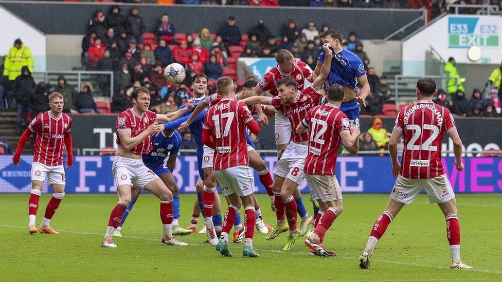 Cardiff and Bristol City players challenge for the ball at Ashton Gate Stadium