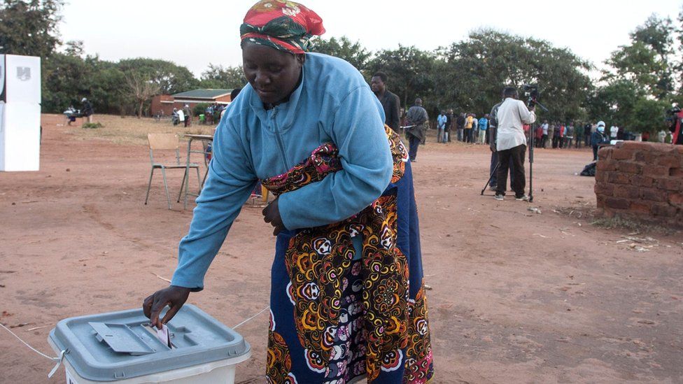 A woman casts her ballot during the presidential elections in Lilongwe on June 23, 2020