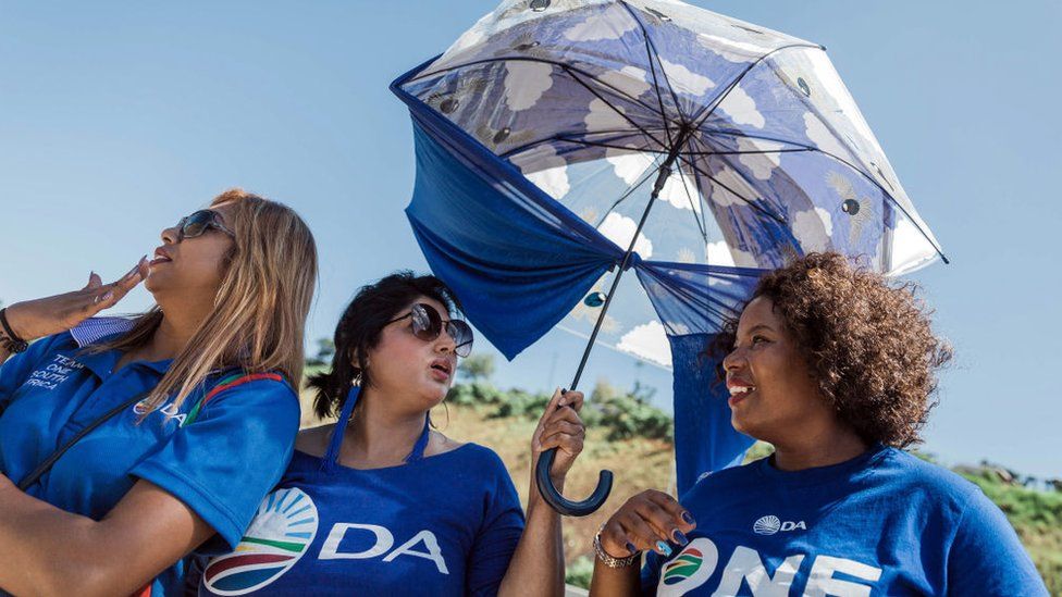 Democratic Alliance members await the arrival of Mmusi Maimane on the campaign trail in Durban on 17 March 2019.