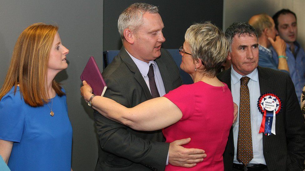 John McCallister is consoled by the SDLP MP Margaret Ritchie after his elimination at the South Down count