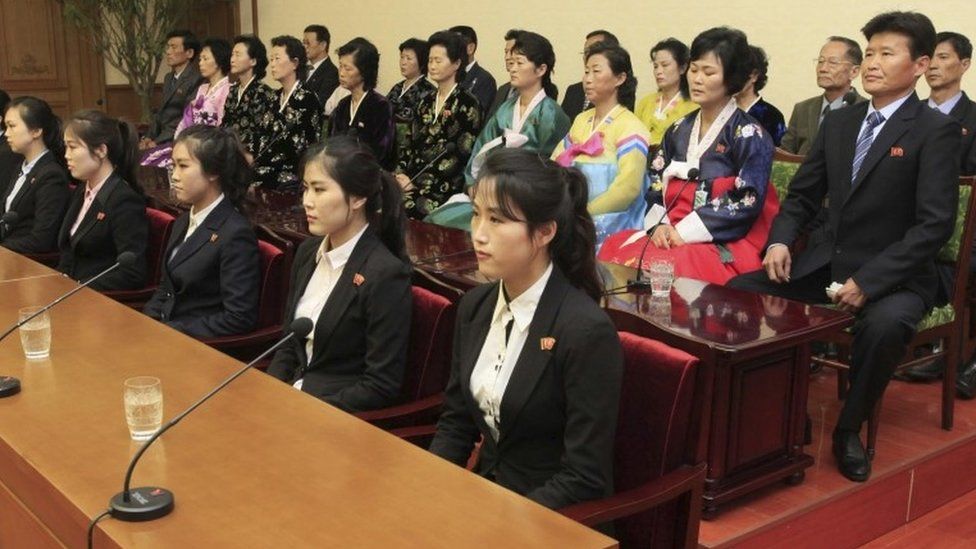 Colleagues and family members of 12 North Korean waitresses are presented to the media in Pyongyang, North Korea, Tuesday, May 3, 2016.