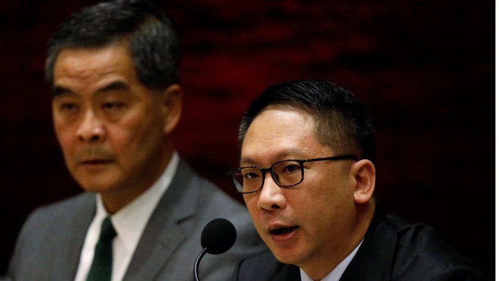 Hong Kong Chief Executive Leung Chun-ying (L) and Secretary for Justice Rimsky Yuen Kwok-keung speak during a news conference after China"s parliament passed an interpretation of Hong Kong"s Basic Law that says lawmakers must swear allegiance to the city as part of China, in Hong Kong November 7, 2016