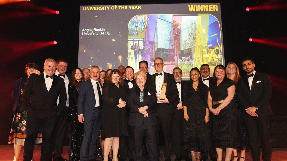 Staff on the stage as the University scoops the award
