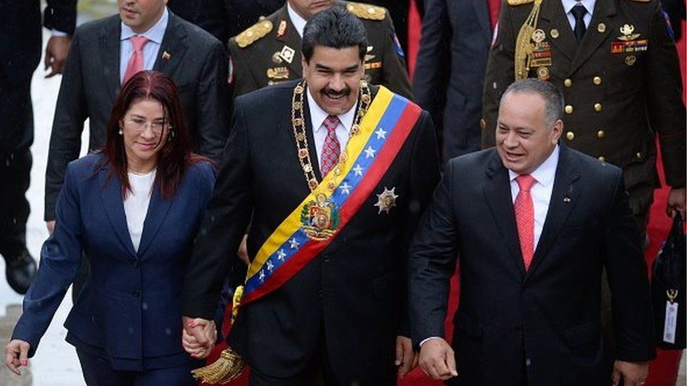 Venezuelan President Nicolas Maduro, his wife Cilia Flores (left) and Venezuelan Assembly President Diosdado Cabello (right) arrive at the National Assembly on 5 July, 2015