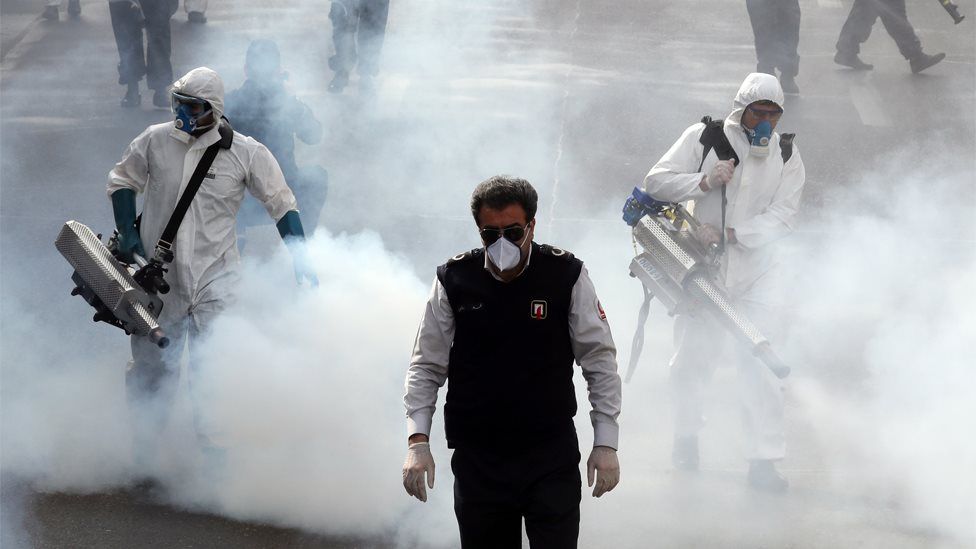 Iranian firefighters disinfect streets in Tehran (13 March 2020)