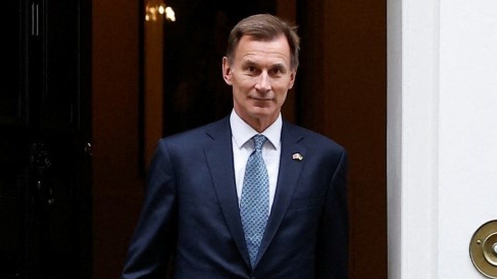 Jeremy Hunt walks out of No 10 on Downing Street in London