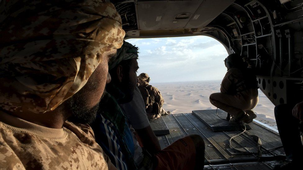 Emirati soldiers flying over the Yemeni desert in a Chinook September 2015