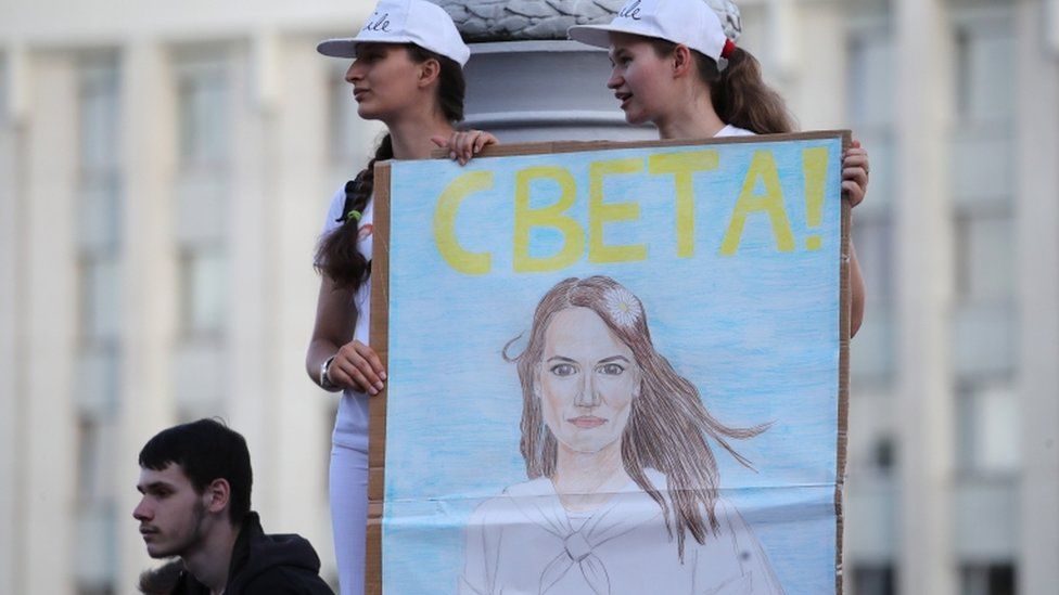 Belarus opposition activists hold a portrait of opposition leader Svetlana Tikhanovskaya during a rally in Minsk, Belarus, 17 August 2020
