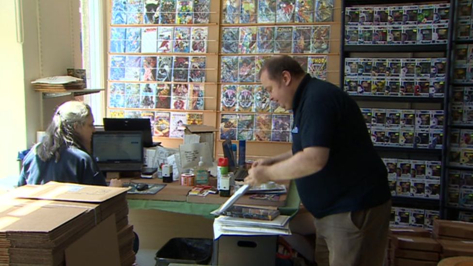 Paul Thomas in his comic book and games shop
