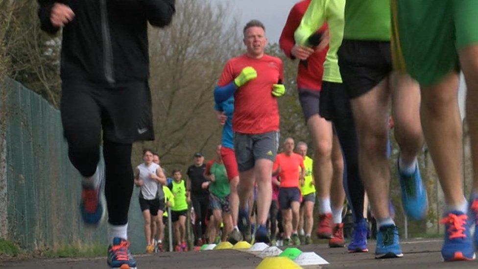 Runners in Little Stoke Park near Bristol taking part in a parkrun UK event