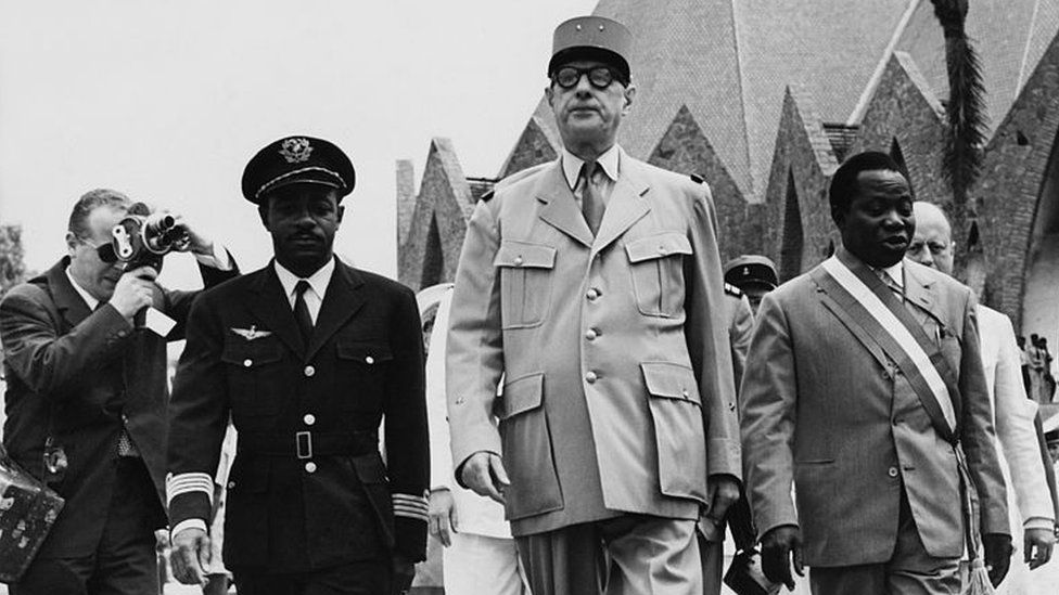 French Prime Minister Charles de Gaulle (centre) with Barthélemy Boganda (right), founder of the pro-independence Social Evolution Movement of Black Africa (MESAN), in 1958