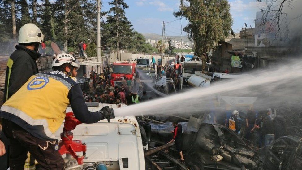 First responders from Syria Civil Defence put out a fire after a reported truck bomb attack in Afrin, north-western Syria, on 28 April 2020