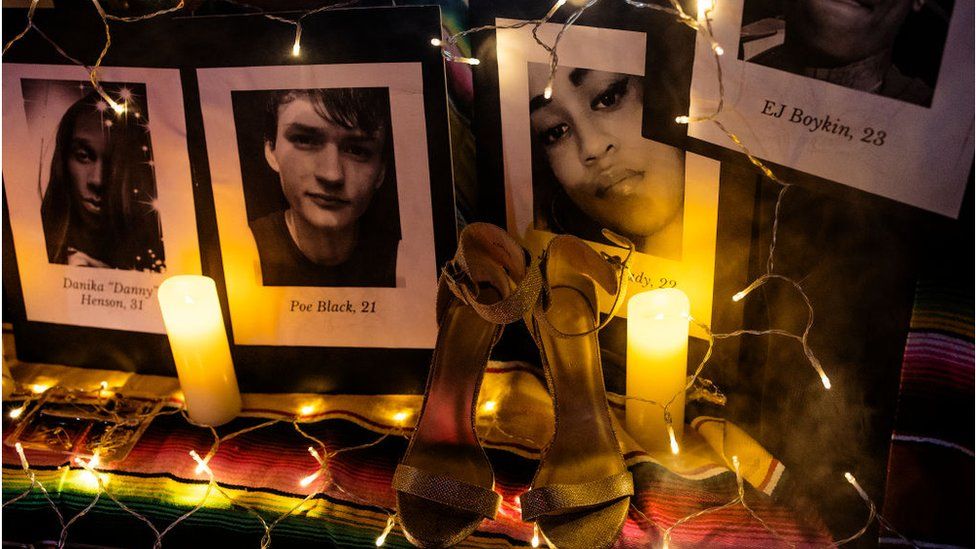 Photos and candles mark a memorial vigil
