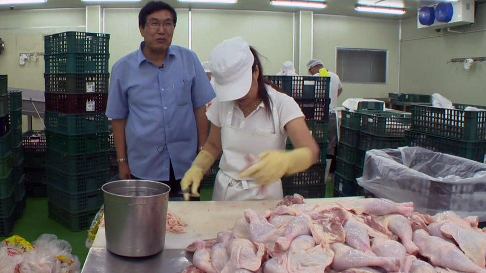 Kim Song-il at his chicken cutting business