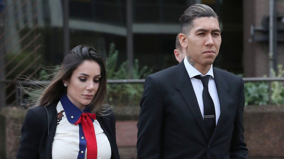 Larissa Pereira and Roberto Firmino leaving court