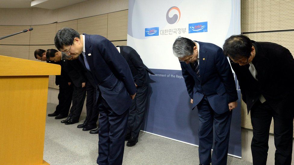 Executives of Ministry of Culture, Sports and Tourism bow as they release a statement of apology to the nation at the government complex in Sejong, South Korea, on 23 January 2017