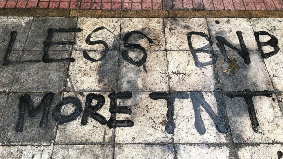 'Less BNB, more TNT' - message spray painted on the floor in Exarchia.