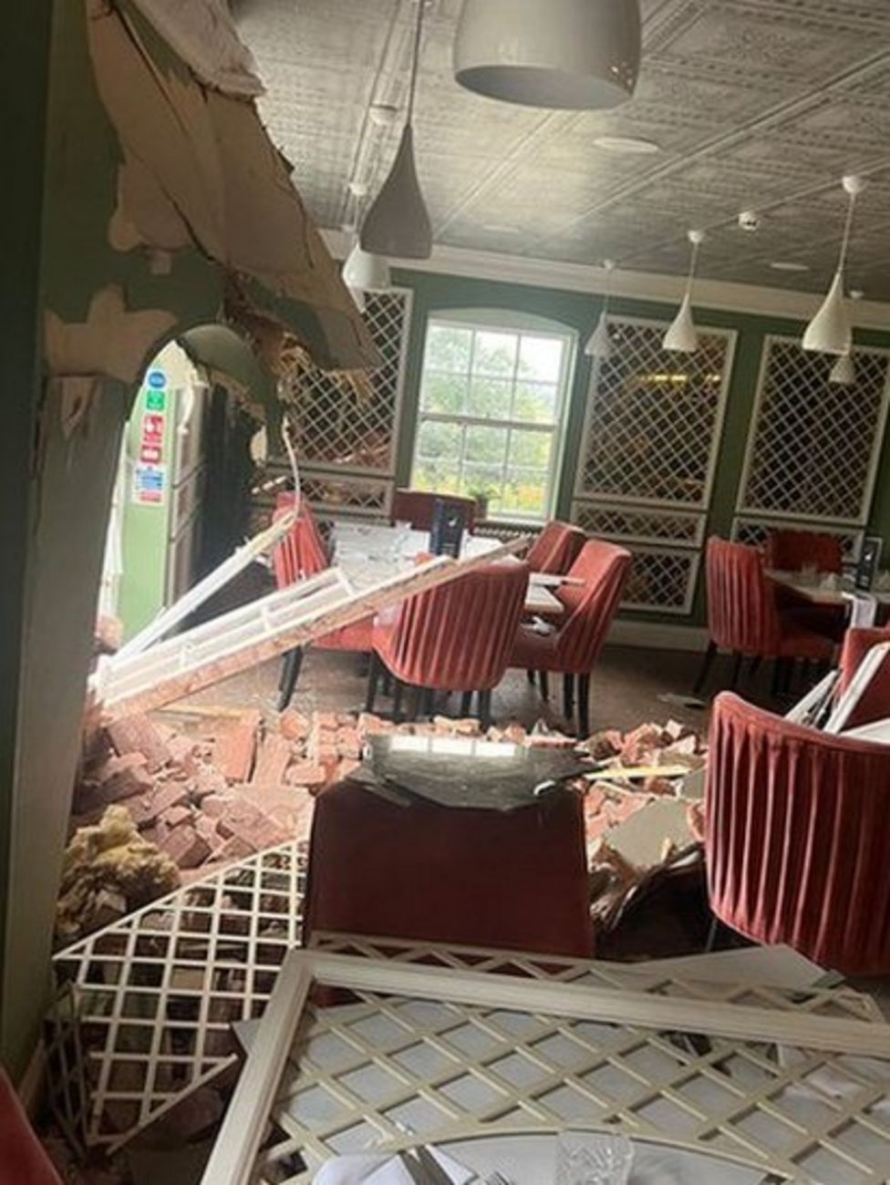 Stolen digger repeatedly rams into restaurant BBC News