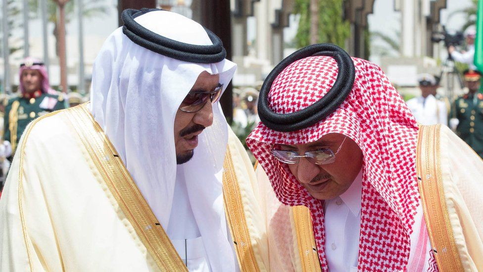 Saudi Arabia's King Salman bin Abdul Aziz Al Saud speaks with Crown Prince Mohammed Bin Nayef during a reception ceremony in Jeddah