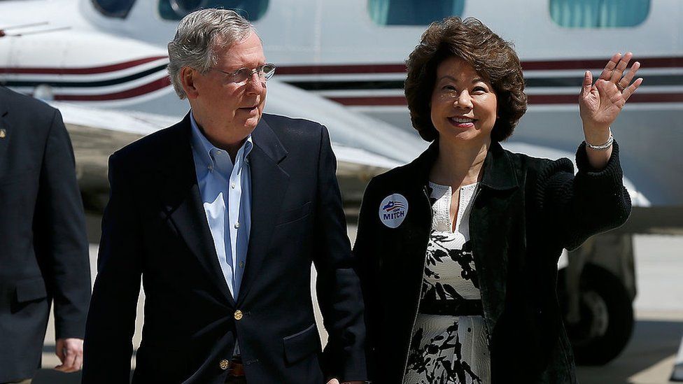 Senate Republican Leader Sen. Mitch McConnell (L) arrives for a campaign rally with his wife Elaine Chao (R) in Louisville, Kentucky in 2014.