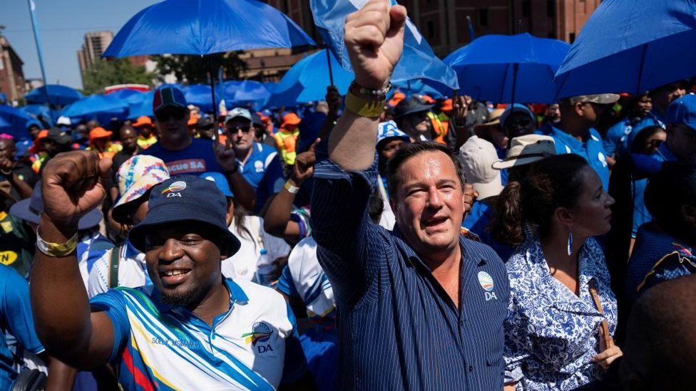 John Steenhuisen leader of South Africa's biggest opposition party, the Democratic Alliance, marches with supporters to the Union Buildings as part of the political party's manifesto launch in Pretoria, South Africa February 17, 2024.