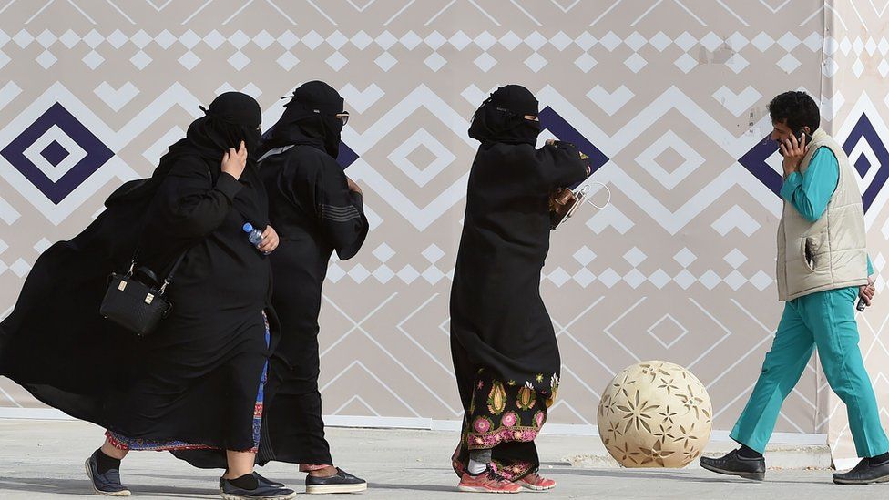 Saudi women wearing the abaya at a camel festival