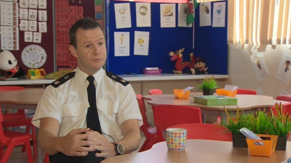 Supt Mike Richards of Gwent Police, sitting in a classroom