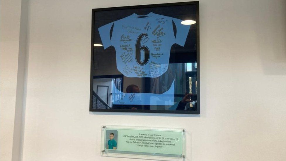 Luke's football shirt and plaque