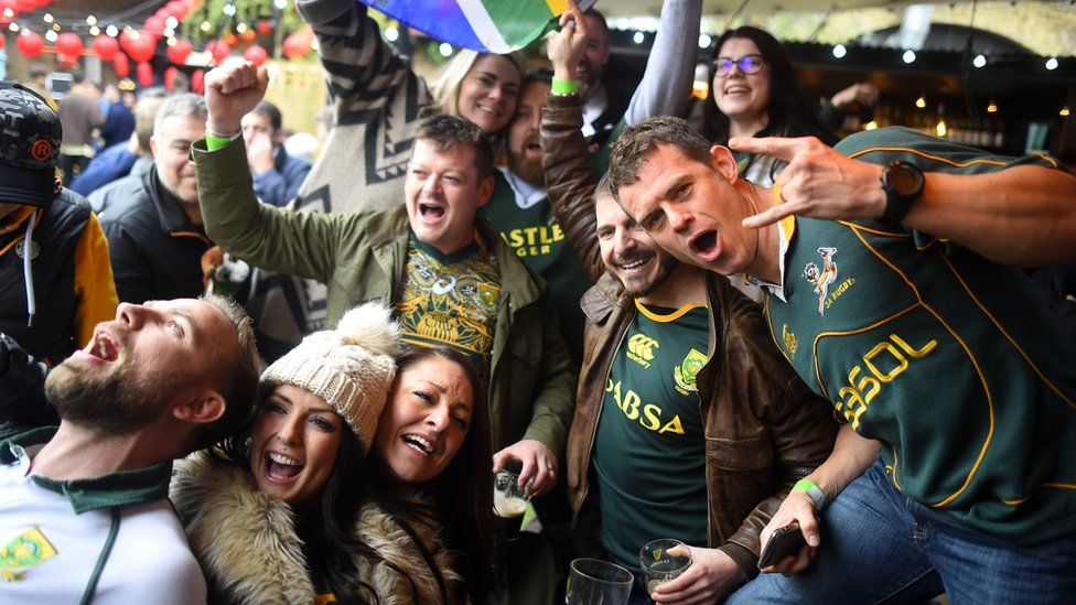 South Africa rugby fans celebrate their win at Flat Iron Square in London
