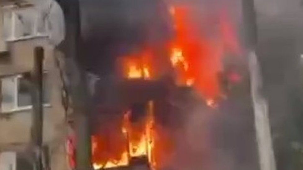 A still taken from a video of a building burning
