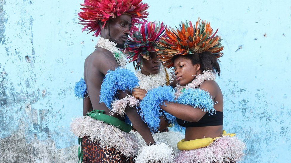 Dancers prepare on the sidelines of the intercommunity cultural meeting organised in Bali district, in Douala, on May 13, 2023.