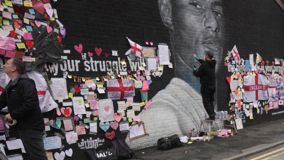 Artist repairs defaced mural of Marcus Rashford