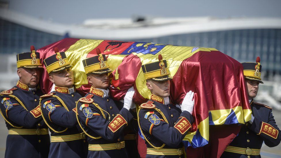 Honour guard soldiers carry the flag-draped coffin of Anne of Romania, before a religious service, in Otopeni, Romania