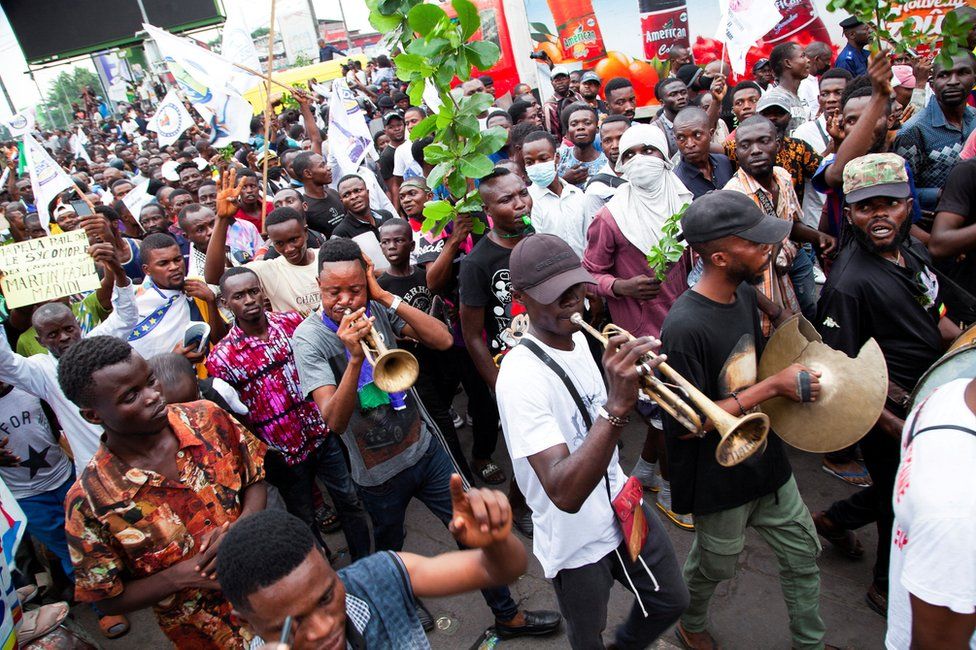 Musicians play during a demonstration by supporters of opposition leader Martin Fayulu, against changes to the independence of the country's electoral commission, in Kinshasa.