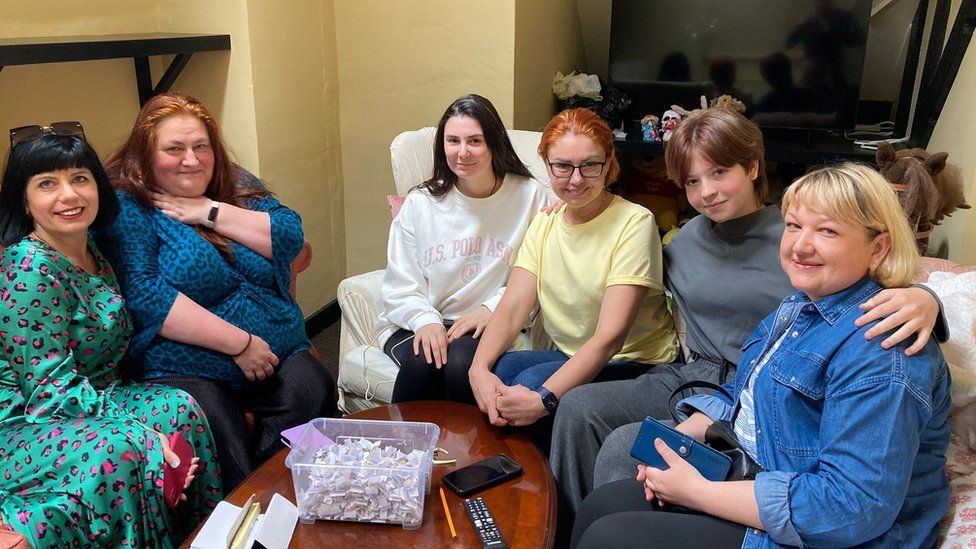 Emma Nishigaki (second left) with women at the support centre