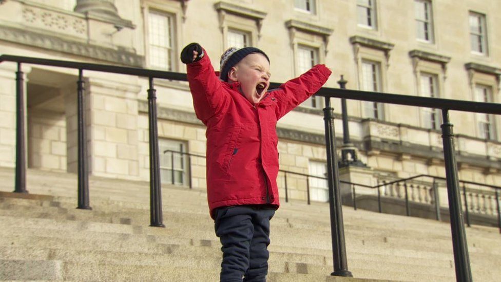 Dáithí MacGabhann on the steps of Stormont after the bill passed