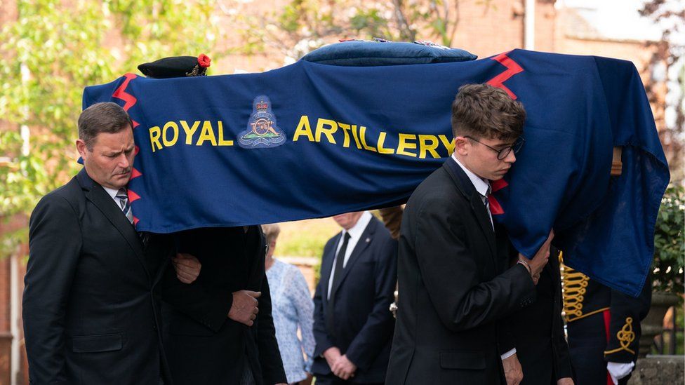 The coffin of D-Day veteran Joe Cattini is carried into St Edmund's Church in Bury St Edmunds, Suffolk