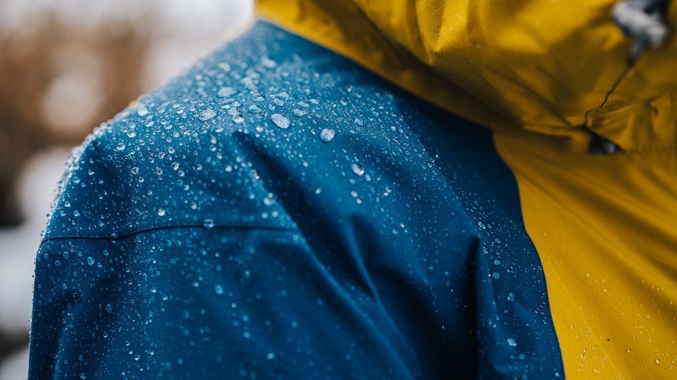 Rainjacket with water droplets collecting on the surface