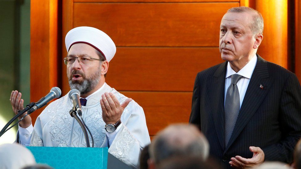 Turkish President Tayyip Erdogan prays at the inauguration of the Cologne Central Mosque in Cologne, Germany on 29 September 2018.