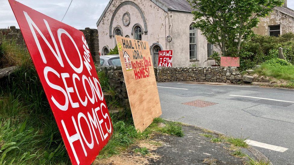 Sign outside a chapel says 'no more second homes'