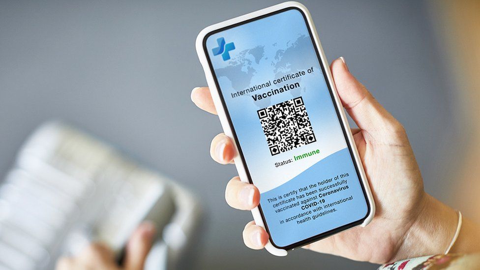 Stock image of vaccine passport on smartphone