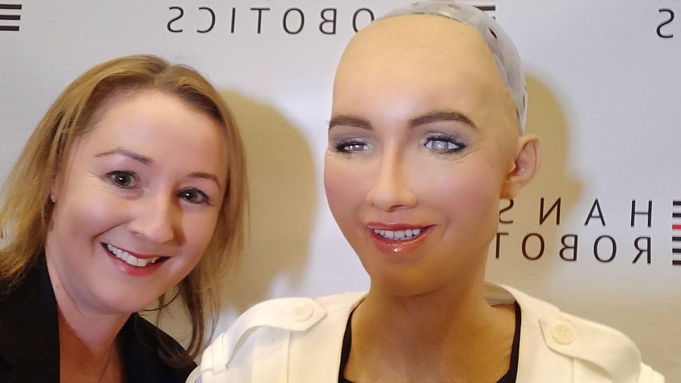 Zoe Kleinman and Sophia the robot