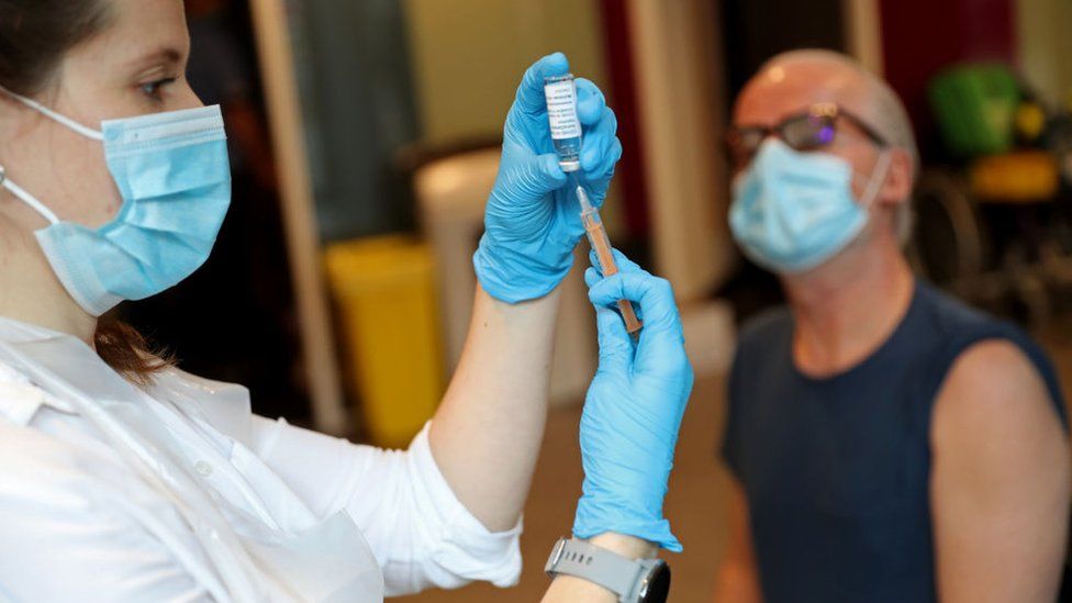 Vaccinator prepares to give a Covid vaccine