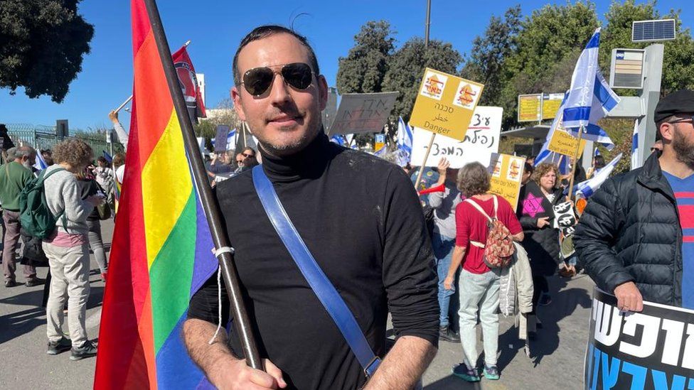 Israeli LGBTQ activist Daniel Johnas protests outside the Knesset in Jerusalem on 29 December 2022