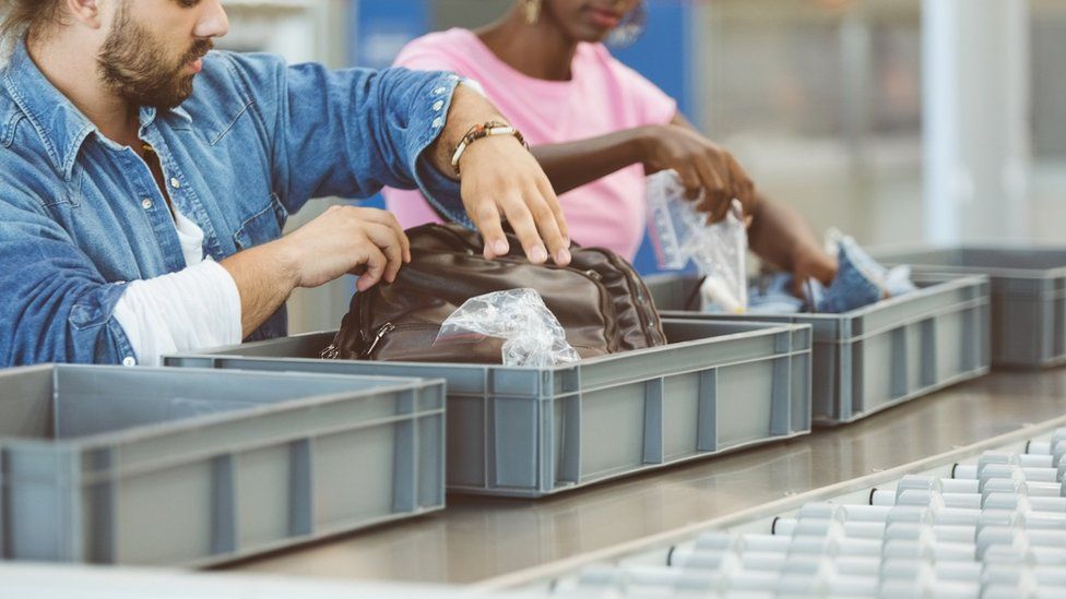 Tourists at airport security